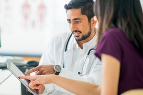 male-doc-tablet-patient-in-purple.jpg